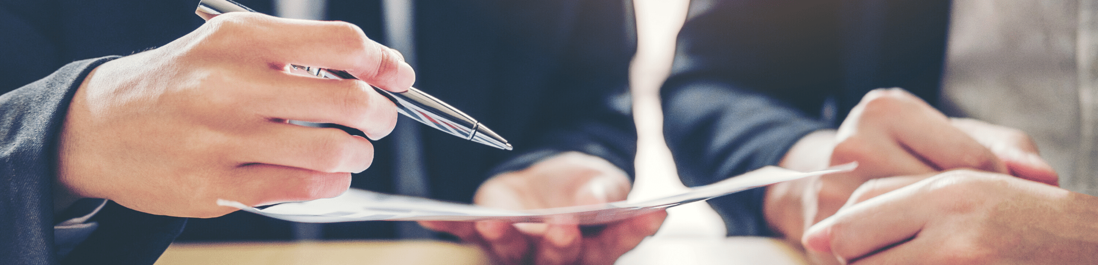 two business people looking over a document