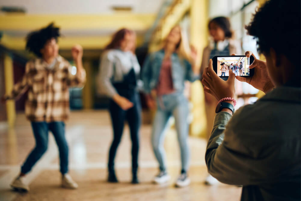 Teens filming social media video